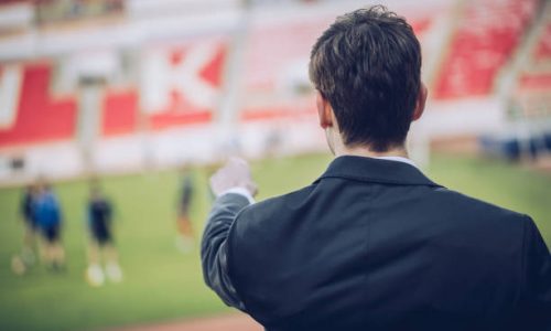 Manager man standing on stadium grandstand